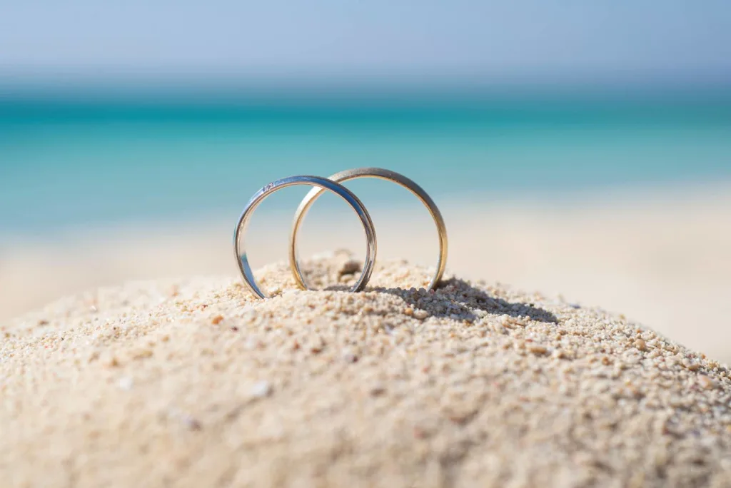 Wedding ring bands in sand